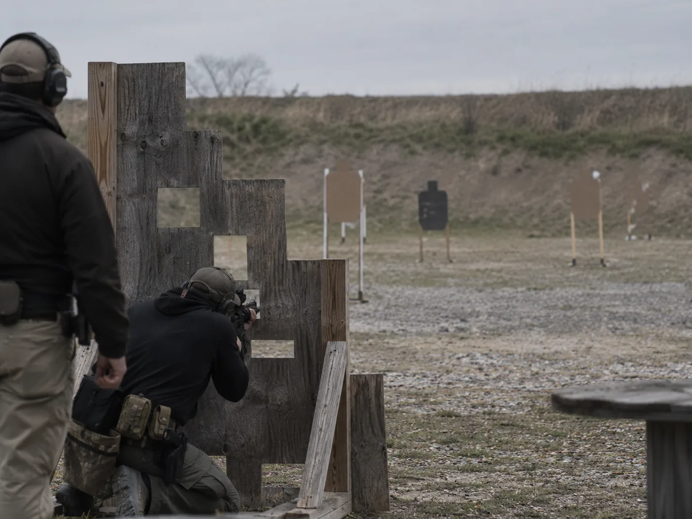 Shooter engaging targets from behind a barricade