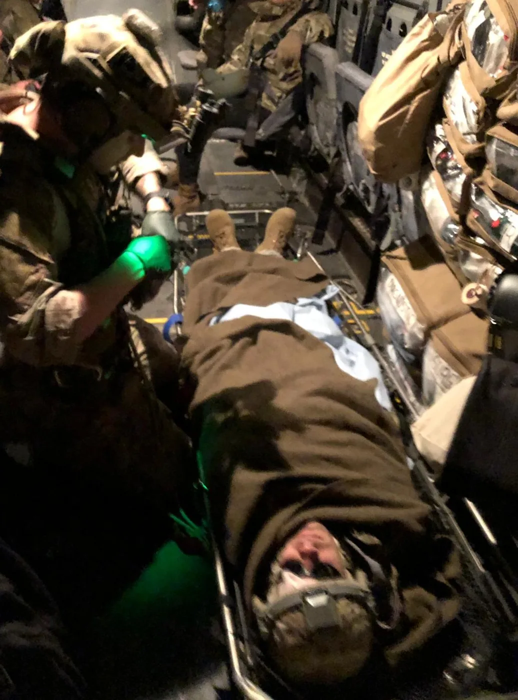 Casualty on a litter during evacuation